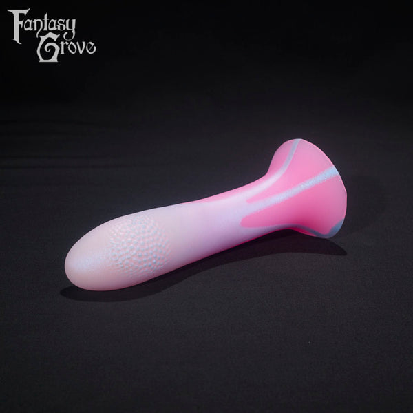 A Fantasy Grove sex toy on a black background with a logo in the upper left corner