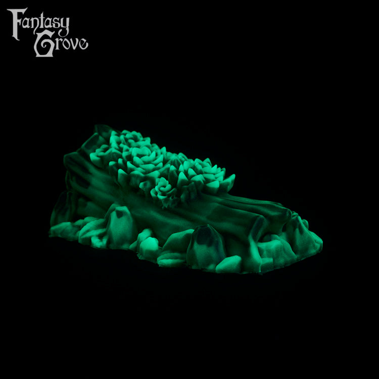 A fantasy sex toy on a black background with the Fantasy Grove logo in the upper left corner