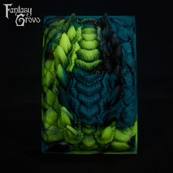 A fantasy sex toy on a black background with the Fantasy Grove logo in the upper left corner