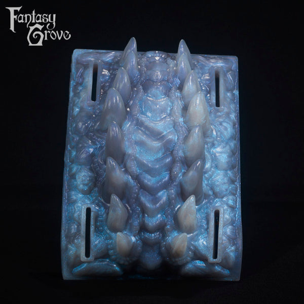 A fantasy sex toy on a black background with the Fantasy Grove logo in the upper left corner