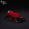 A Fantasy Grove sex toy on a black background with a logo in the upper left corner