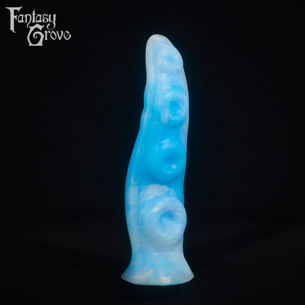 A fantasy sex toy on a black background with the Fantasy Grove logo in the upper left corner