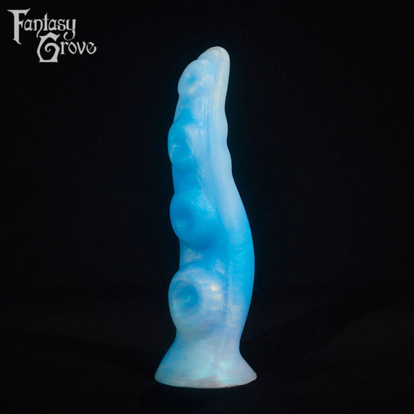 A fantasy sex toy on a black background with the Fantasy Grove logo in the upper left corner