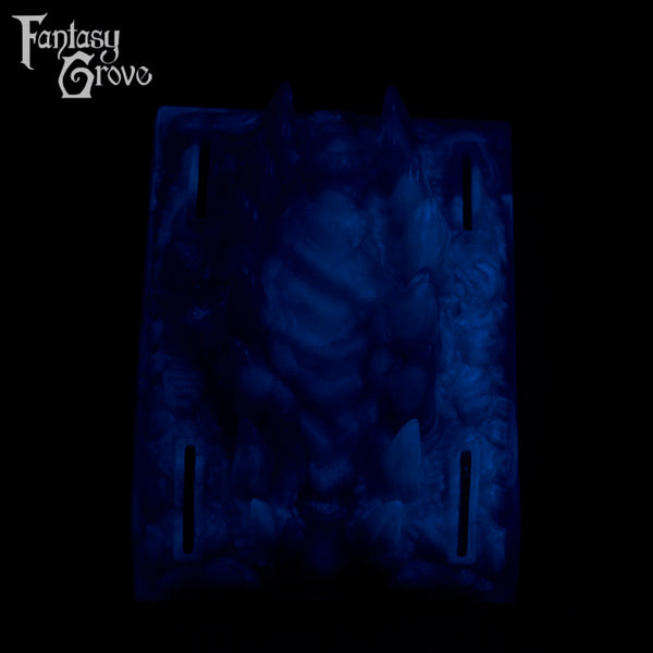 A fantasy sex toy on a black background with the Fantasy Grove logo in the upper left corner