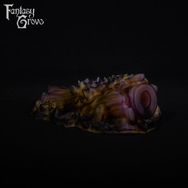 A fantasy sex toy on a black background with the Fantasy Grove logo in the upper left corner