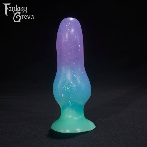 A Fantasy Grove sex toy on a black background with a logo in the upper left corner