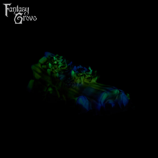 A fantasy sex toy on a black background with the Fantasy Grove logo in the upper left corner