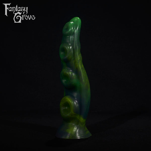 A fantasy sex toy on a black background with the Fantasy Grove logo in the upper left corner