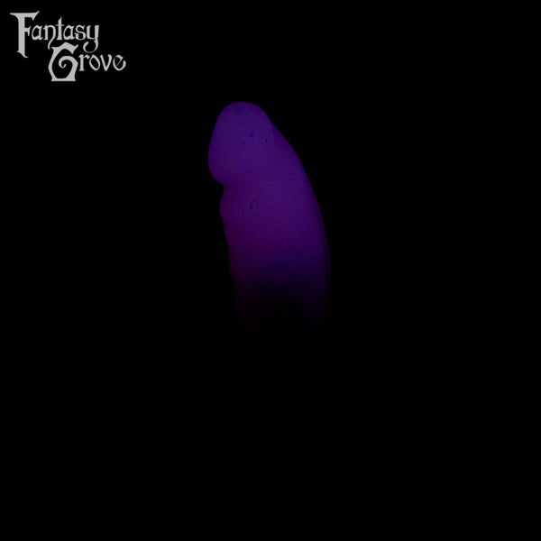 A fantasy sex toy on a black background with the Fantasy Grove logo in the upper left corner