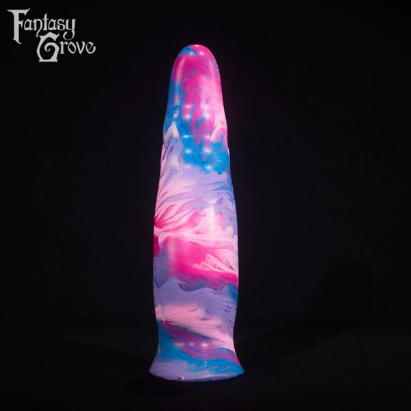 A fantasy sex toy on a black background with the Fantasy Grove logo in the upper left corner