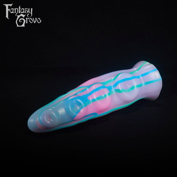 A fantasy sex toy on a black background with the Fantasy Grove logo in the upper left corner