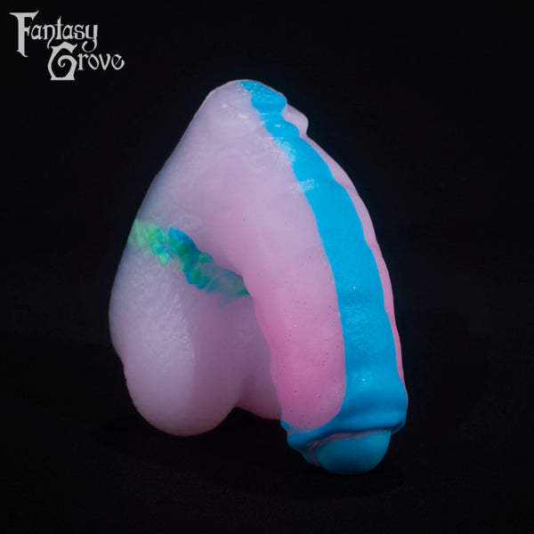 A fantasy sex toy on a black background with the Fantasy Grove logo in the upper left corner