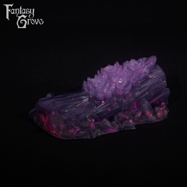 A fantasy sex toy on a black background with the Fantasy Grove logo in the upper left corner
