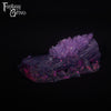 A fantasy sex toy on a black background with the Fantasy Grove logo in the upper left corner