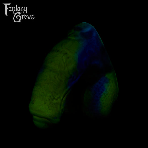 A fantasy sex toy on a black background with the Fantasy Grove logo in the upper left corner