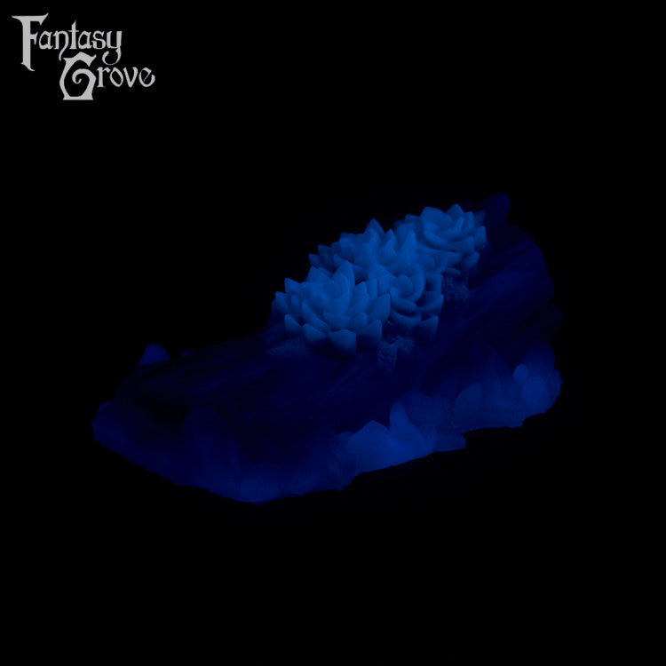 A fantasy sex toy on a black background with the Fantasy Grove logo in the upper left corner