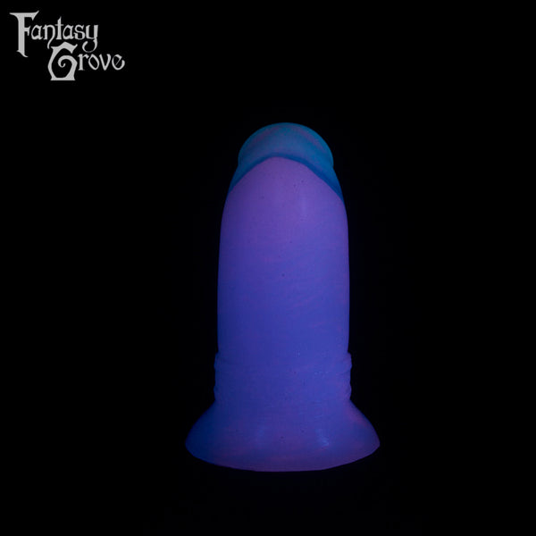 A fantasy sex toy on a black background with the Fantasy Grove logo in the upper left corner