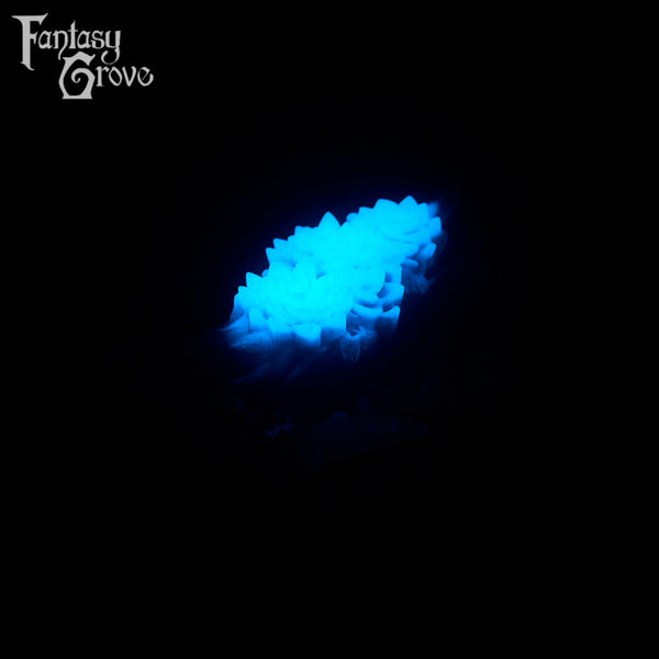A fantasy sex toy on a black background with the Fantasy Grove logo in the upper left corner