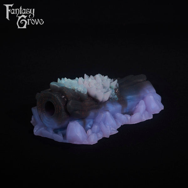 A fantasy sex toy on a black background with the Fantasy Grove logo in the upper left corner