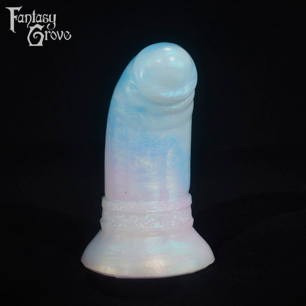 A fantasy sex toy on a black background with the Fantasy Grove logo in the upper left corner
