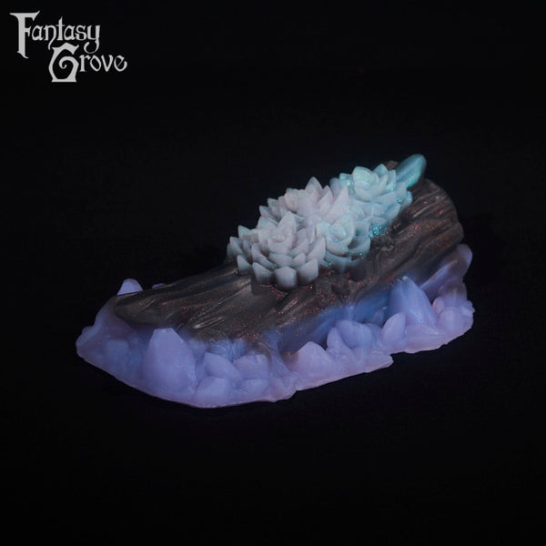 A fantasy sex toy on a black background with the Fantasy Grove logo in the upper left corner