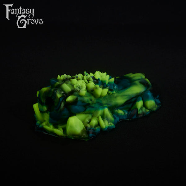 A fantasy sex toy on a black background with the Fantasy Grove logo in the upper left corner