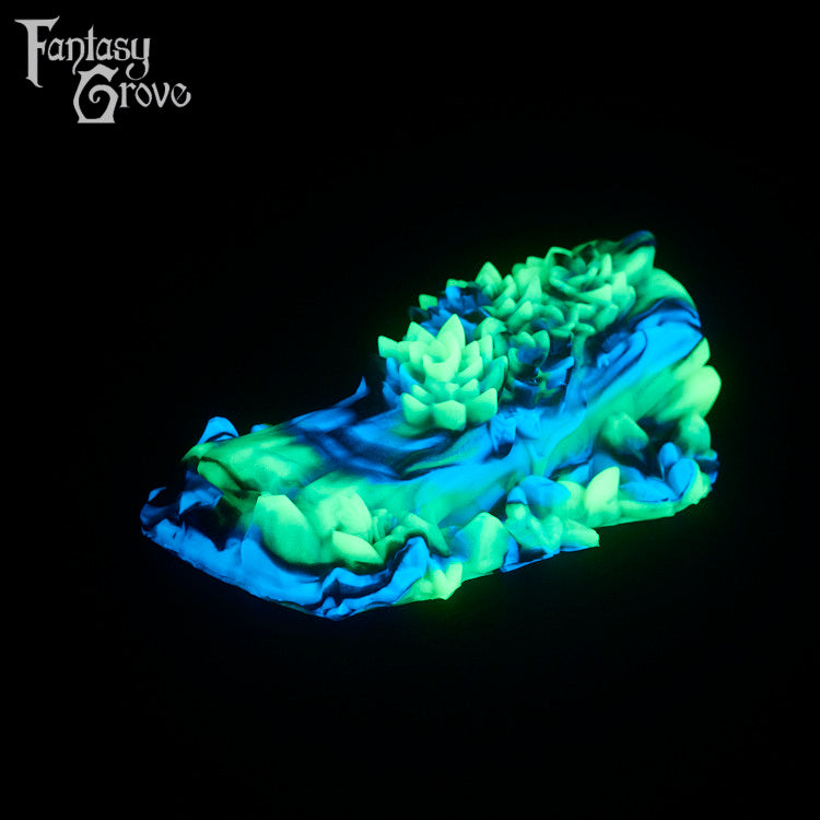 A fantasy sex toy on a black background with the Fantasy Grove logo in the upper left corner