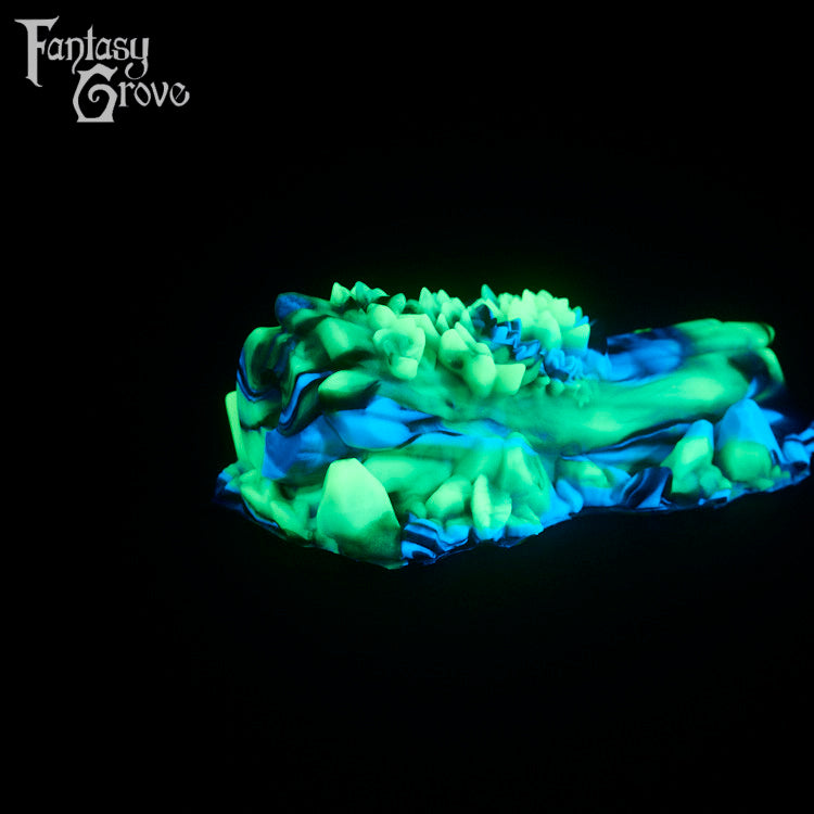 A fantasy sex toy on a black background with the Fantasy Grove logo in the upper left corner