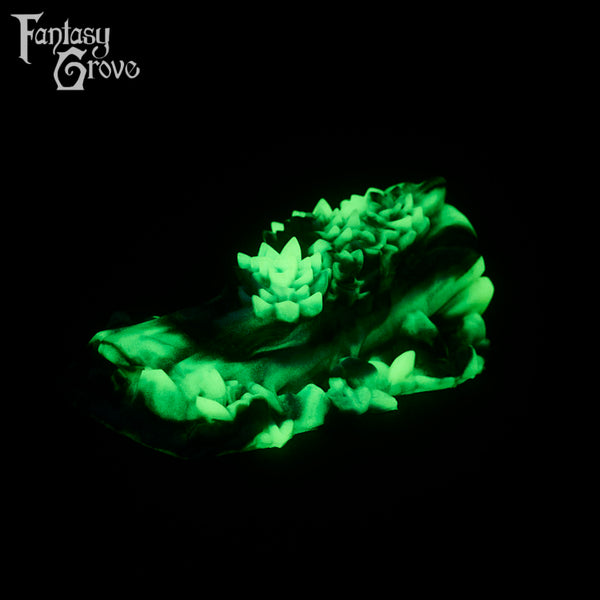 A fantasy sex toy on a black background with the Fantasy Grove logo in the upper left corner