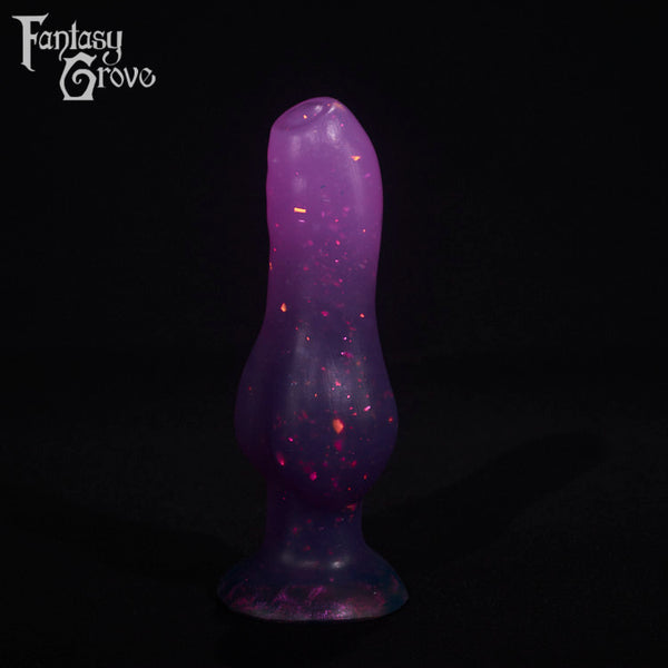 A fantasy sex toy on a black background with the Fantasy Grove logo in the upper left corner