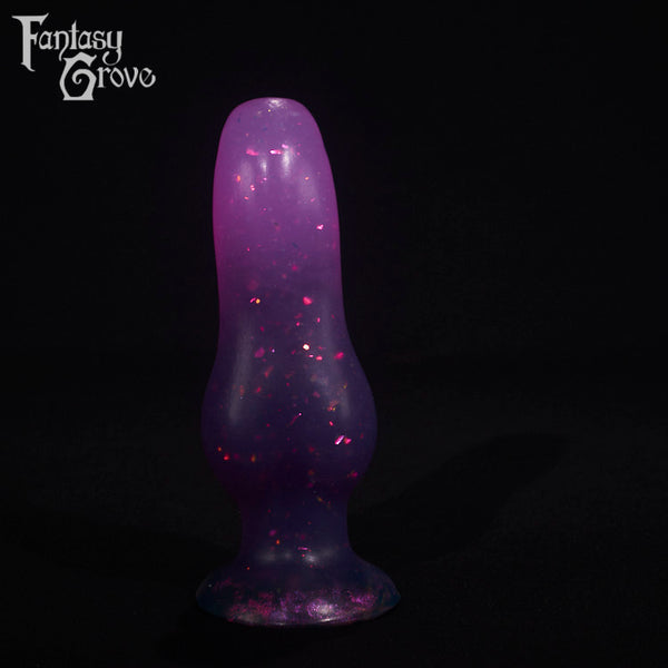 A fantasy sex toy on a black background with the Fantasy Grove logo in the upper left corner