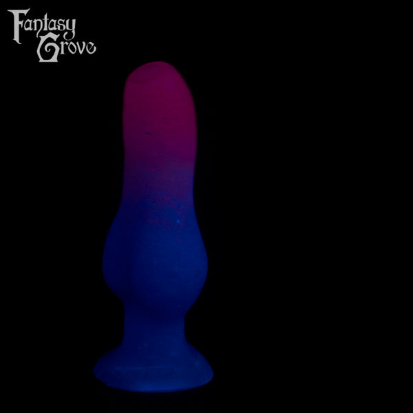 A fantasy sex toy on a black background with the Fantasy Grove logo in the upper left corner