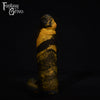 A fantasy sex toy on a black background with the Fantasy Grove logo in the upper left corner
