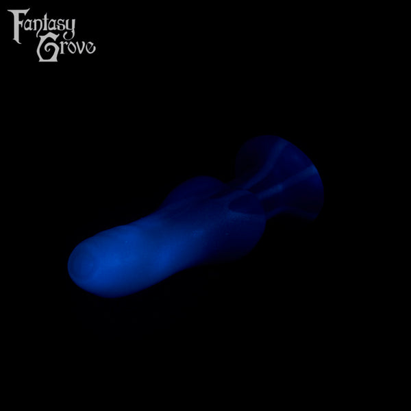 A fantasy sex toy on a black background with the Fantasy Grove logo in the upper left corner