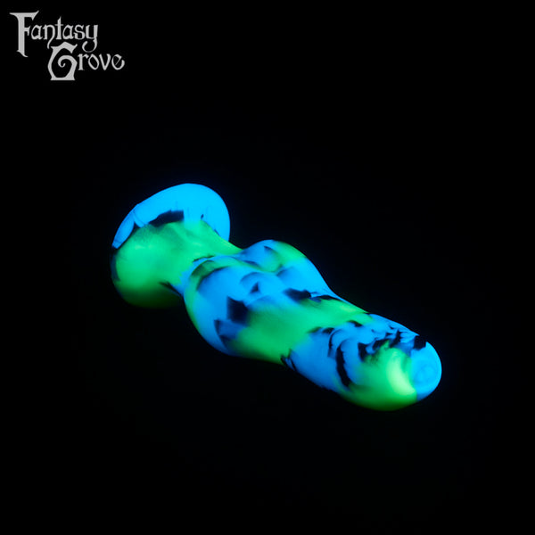 A fantasy sex toy on a black background with the Fantasy Grove logo in the upper left corner