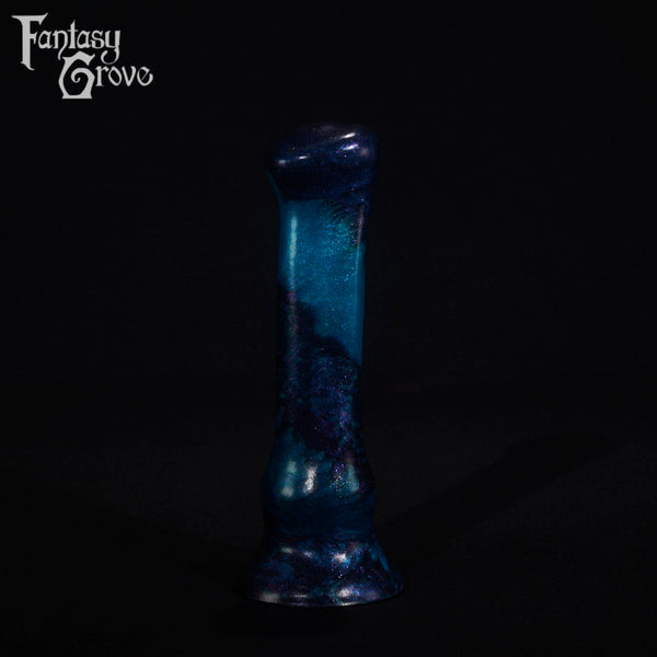 A fantasy sex toy on a black background with the Fantasy Grove logo in the upper left corner
