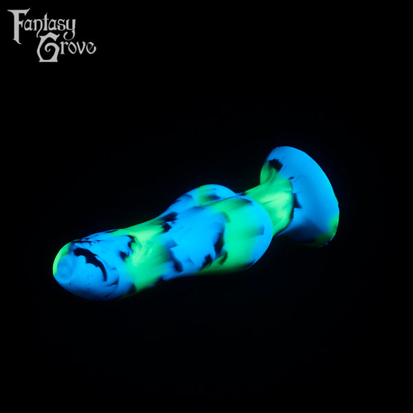 A fantasy sex toy on a black background with the Fantasy Grove logo in the upper left corner
