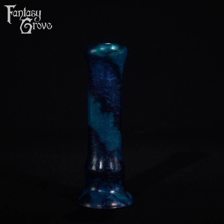 A fantasy sex toy on a black background with the Fantasy Grove logo in the upper left corner