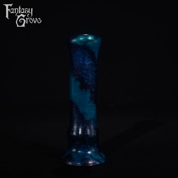 A fantasy sex toy on a black background with the Fantasy Grove logo in the upper left corner