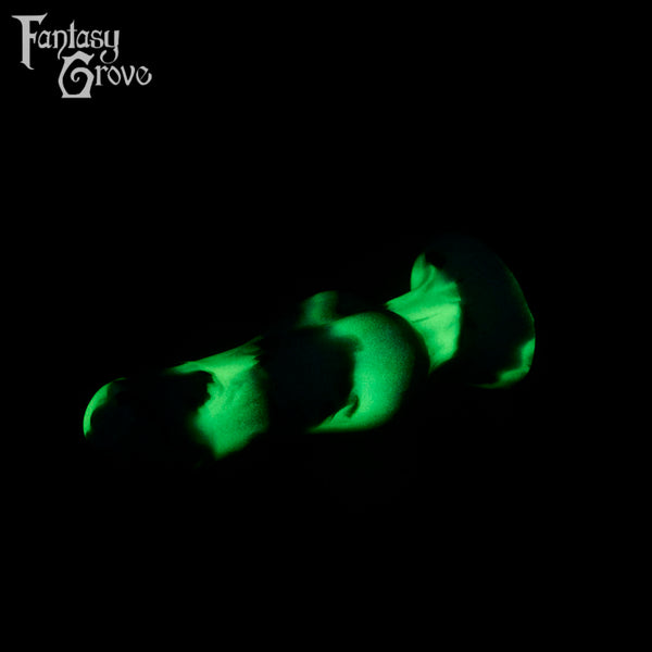 A fantasy sex toy on a black background with the Fantasy Grove logo in the upper left corner