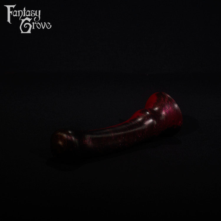 A fantasy sex toy on a black background with the Fantasy Grove logo in the upper left corner