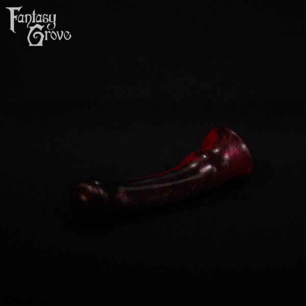 A fantasy sex toy on a black background with the Fantasy Grove logo in the upper left corner