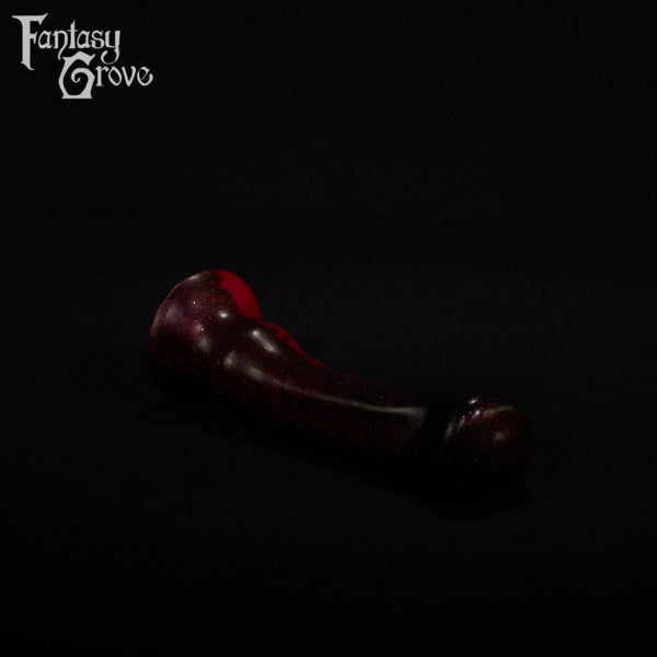 A fantasy sex toy on a black background with the Fantasy Grove logo in the upper left corner
