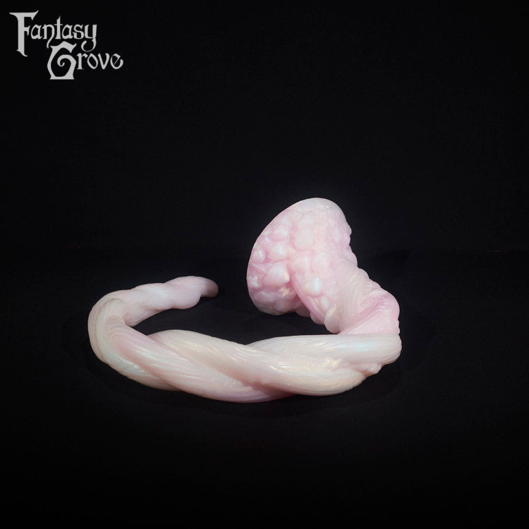 A fantasy sex toy on a black background with the Fantasy Grove logo in the upper left corner