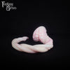 A fantasy sex toy on a black background with the Fantasy Grove logo in the upper left corner