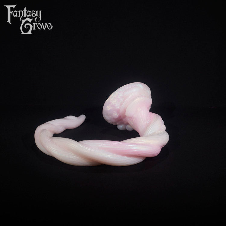 A fantasy sex toy on a black background with the Fantasy Grove logo in the upper left corner