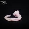 A fantasy sex toy on a black background with the Fantasy Grove logo in the upper left corner