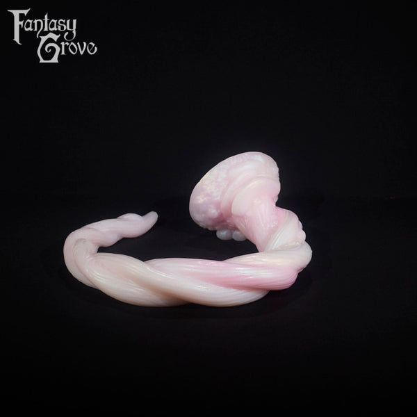 A fantasy sex toy on a black background with the Fantasy Grove logo in the upper left corner