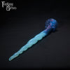 A Fantasy Grove sex toy on a black background with a logo in the upper left corner