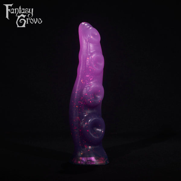 A fantasy sex toy on a black background with the Fantasy Grove logo in the upper left corner